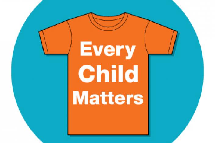 Orange t-shirt on a blue background. White writing on the shirt says every child matters