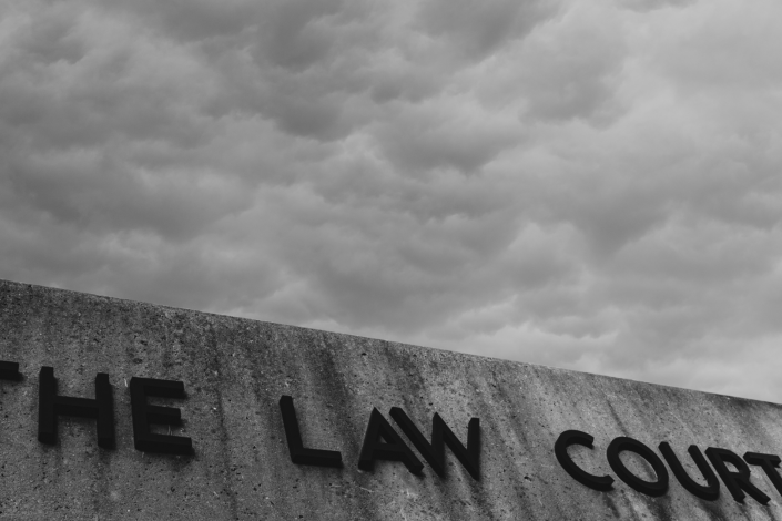 Black and white image of concrete Law Courts building